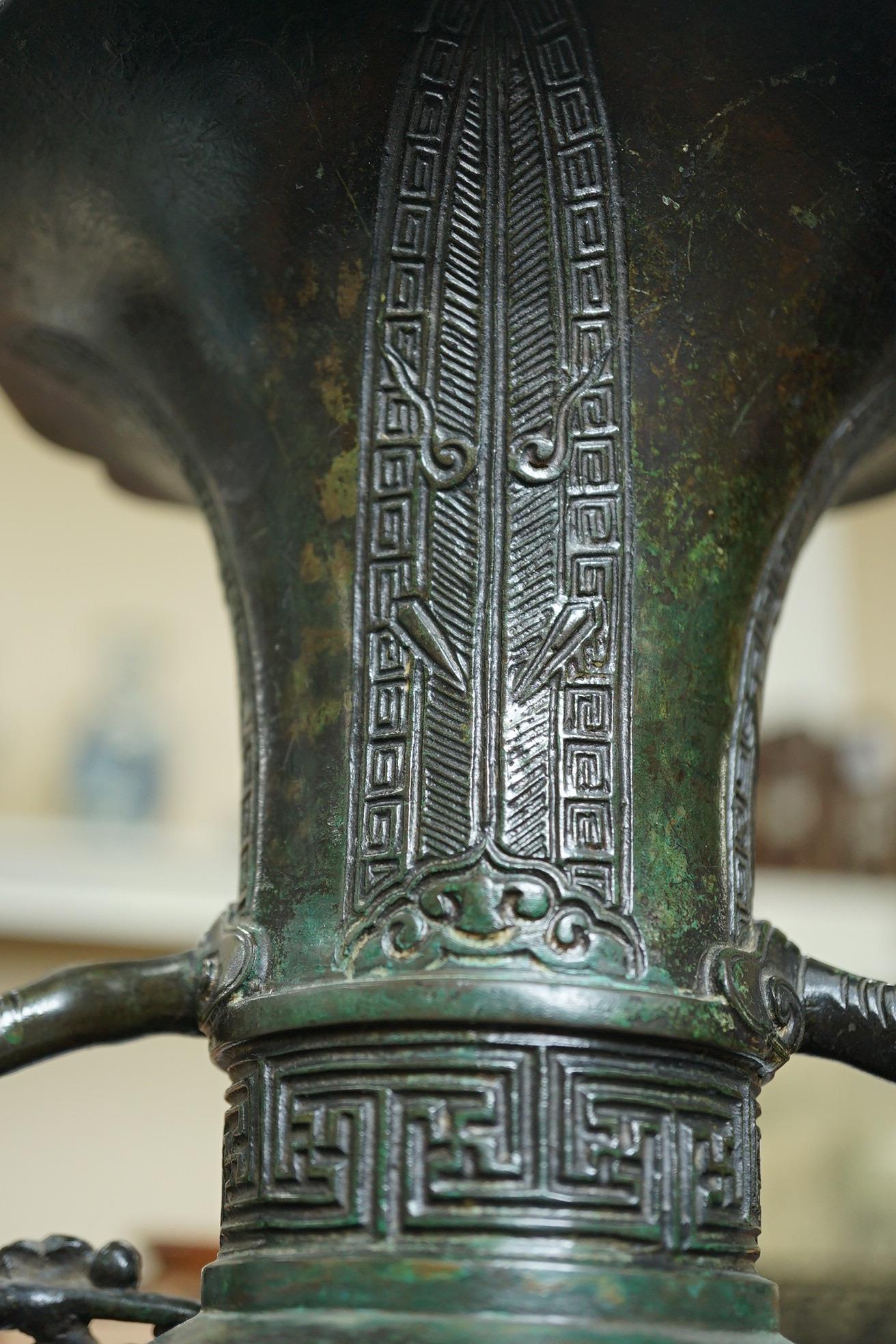A pair of Chinese bronze gu-shaped vases, Qing dynasty
